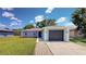 Charming single-story home with a well-maintained lawn and a one-car garage at 1707 24Th E St, Palmetto, FL 34221