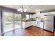 Functional kitchen with white appliances, modern lighting, and access to the backyard at 1707 24Th E St, Palmetto, FL 34221