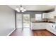 Charming kitchen with white cabinets, dark countertops, and a sliding glass door to the backyard at 1707 24Th E St, Palmetto, FL 34221