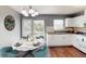 Updated kitchen featuring a dining table, white cabinets, and modern decor at 1707 24Th E St, Palmetto, FL 34221
