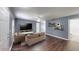 Inviting staged living room boasts hardwood floors, neutral decor, and ample natural light at 1707 24Th E St, Palmetto, FL 34221