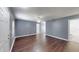 A spacious living room with hardwood floors and neutral-colored walls at 1707 24Th E St, Palmetto, FL 34221