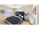 Bedroom features a queen bed, neutral walls and tile floors at 1707 24Th E St, Palmetto, FL 34221