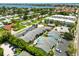 Stunning aerial view of a community with beautiful landscaping and a sparkling swimming pool near the intercoastal at 1753 Dawn St # 305, Sarasota, FL 34231