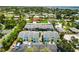 Community view showcasing colorful townhomes with private parking and mature greenery around the property at 1753 Dawn St # 305, Sarasota, FL 34231