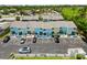 Aerial view of the property featuring well-maintained townhomes, parking, and green spaces at 1753 Dawn St # 305, Sarasota, FL 34231