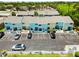 Aerial view of the property featuring well-maintained townhomes, parking, and green spaces at 1753 Dawn St # 305, Sarasota, FL 34231