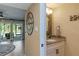 Stylish bathroom with granite countertop vanity and decorative mirror at 1753 Dawn St # 305, Sarasota, FL 34231