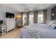 Comfortable bedroom featuring ceiling fan, light wood flooring, and patio access at 1753 Dawn St # 305, Sarasota, FL 34231