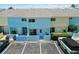 Colorful townhome exterior featuring assigned parking spaces with easy access to nearby amenities and attractions at 1753 Dawn St # 305, Sarasota, FL 34231