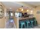 Modern kitchen with a breakfast bar and pendant lighting, open to the living area at 1753 Dawn St # 305, Sarasota, FL 34231