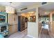 Bright kitchen featuring stainless steel appliances, open layout, wood floors, and breakfast bar at 1753 Dawn St # 305, Sarasota, FL 34231