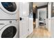 Convenient laundry room featuring stacked washer and dryer and leads to bedroom at 1753 Dawn St # 305, Sarasota, FL 34231
