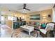 Cozy open living room connected to the kitchen, with nautical decor and comfortable seating at 1753 Dawn St # 305, Sarasota, FL 34231