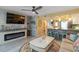 Open-concept living area with fireplace, breakfast bar, and coastal-themed décor at 1753 Dawn St # 305, Sarasota, FL 34231