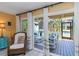 Outdoor patio featuring comfortable seating, sliding glass doors, and inviting decor at 1753 Dawn St # 305, Sarasota, FL 34231