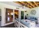 Covered patio with seating area and fan with view into kitchen at 1753 Dawn St # 305, Sarasota, FL 34231