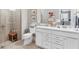 Bathroom featuring double sinks, a glass shower, and neutral-colored walls at 17648 Northwood Pl, Lakewood Ranch, FL 34202