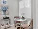 Bright breakfast nook with shuttered windows, a round table, and comfortable seating at 17648 Northwood Pl, Lakewood Ranch, FL 34202