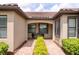 Inviting entrance featuring brick pavers, manicured shrubbery, and an arched entryway at 17648 Northwood Pl, Lakewood Ranch, FL 34202