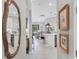 Hallway view leading to living area with tile floors and modern decor at 17648 Northwood Pl, Lakewood Ranch, FL 34202