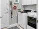 Clean laundry room with white cabinets, a washer, and a dryer at 17648 Northwood Pl, Lakewood Ranch, FL 34202