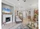 Cozy living space with a fireplace, stylish seating, and an open floor plan at 17648 Northwood Pl, Lakewood Ranch, FL 34202