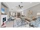Spacious living room with a fireplace, elegant furnishings, and an open layout at 17648 Northwood Pl, Lakewood Ranch, FL 34202