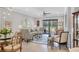 Comfortable living room with sliding glass doors, stylish decor, and ample natural light at 17648 Northwood Pl, Lakewood Ranch, FL 34202