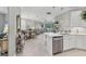 Spacious open-concept kitchen and living area with modern lighting and stylish decor at 17648 Northwood Pl, Lakewood Ranch, FL 34202