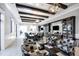 Beautiful clubhouse lounge with beamed ceilings, decorative lighting, and ample seating for residents at 17648 Northwood Pl, Lakewood Ranch, FL 34202