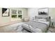 Comfortable bedroom features a large window, neutral tones, stylish decor, and a cozy seating area for a relaxing retreat at 1766 Cobb Trl, Parrish, FL 34219
