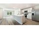 Modern kitchen with stainless steel appliances, a large island, and ample counter space at 1766 Cobb Trl, Parrish, FL 34219
