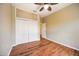 Bedroom boasts wood floors, ample closet space, and a modern ceiling fan at 1801 Highland Rd, Osprey, FL 34229