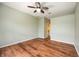 Large bedroom with hardwood floors, ceiling fan, and neutral paint for a customizable living space at 1801 Highland Rd, Osprey, FL 34229