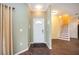 Interior entryway featuring modern flooring, neutral walls, staircase, and natural lighting at 1801 Highland Rd, Osprey, FL 34229