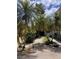 Landscaped front yard features a curved walkway and tropical plants at 1801 Highland Rd, Osprey, FL 34229