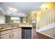Kitchen featuring granite countertops, stainless steel appliances, and a breakfast bar overlooking the living room at 1801 Highland Rd, Osprey, FL 34229