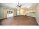 Open concept living room with neutral paint, modern flooring, leading to the kitchen at 1801 Highland Rd, Osprey, FL 34229