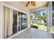 Spacious, screened-in patio offers access to the backyard with lush landscaping at 1801 Highland Rd, Osprey, FL 34229