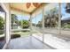 Screened-in patio with views of landscaped backyard and garden at 1801 Highland Rd, Osprey, FL 34229