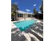 Enjoy a refreshing swim in your own private pool surrounded by tropical landscaping at 1801 Highland Rd, Osprey, FL 34229