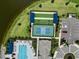 Aerial view of community amenities including pool, tennis, and bocce ball courts at 18039 Cherished Loop, Bradenton, FL 34211