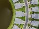 Aerial view showcases neighborhood layout, nearby lake, sidewalks, and pristine landscaping, highlighting community appeal at 18039 Cherished Loop, Bradenton, FL 34211