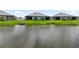 The backyards face a serene waterfront, enhancing the privacy and beauty of each residence at 18039 Cherished Loop, Bradenton, FL 34211
