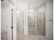 Primary bathroom with glass shower and open access to a walk-in closet at 18039 Cherished Loop, Bradenton, FL 34211