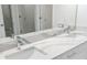 Bathroom with double sinks and elegant, easy-to-clean marble countertops at 18039 Cherished Loop, Bradenton, FL 34211