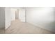 A bright empty bedroom showcasing tile flooring and an open doorway to another room at 18039 Cherished Loop, Bradenton, FL 34211