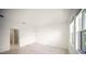 Spacious bedroom with modern floors and large window providing natural light and peaceful views at 18039 Cherished Loop, Bradenton, FL 34211