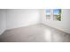 Bright bedroom with large windows offering lovely views of the lake and new, modern floors at 18039 Cherished Loop, Bradenton, FL 34211